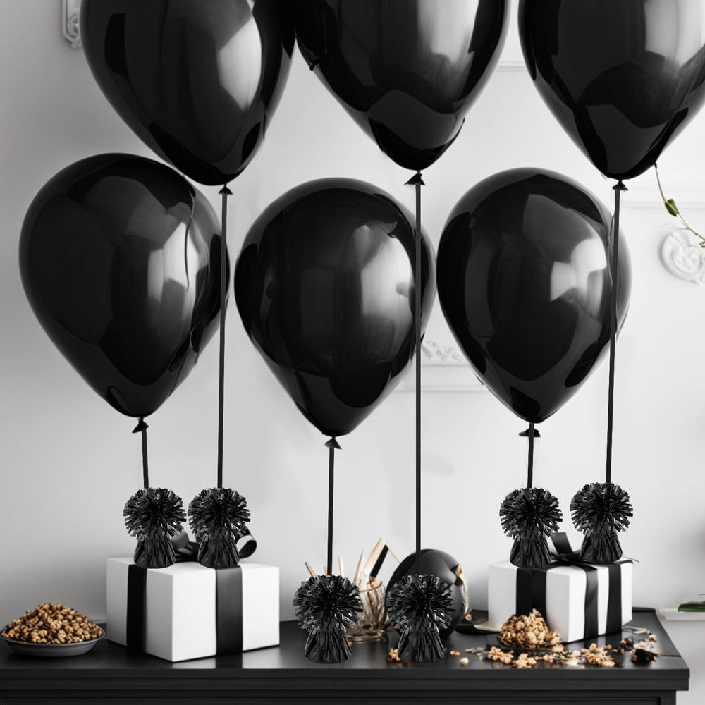 Close-up of KVCSYAW balloon weights used on a table decor setup