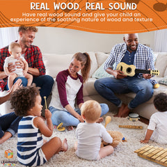 L Learning Toy Boxes mini guitar introduces simple strumming for little hands