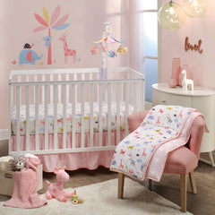 Lambs & Ivy Snuggle Jungle pink giraffe plush complements nursery decor.