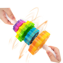 LBAIBB Rainbow Spin Tower in-hand play emphasizing hand-eye coordination
