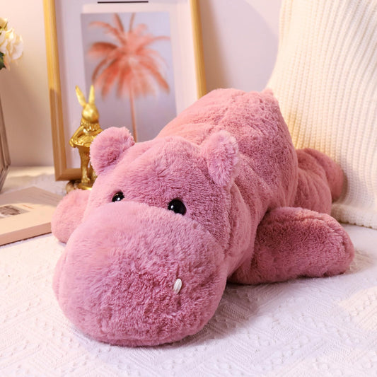 Leahaoe weighted hippo 23.6-inch pink plush on bed for cozy comfort.