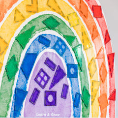 Learn & Grow magnetic wall decal rainbow-doodle-board provides a writable, kid-friendly surface.