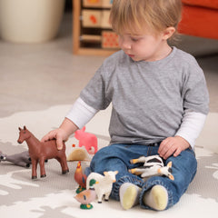 Learning Minds pig figurine for imaginative farm play and early learning.