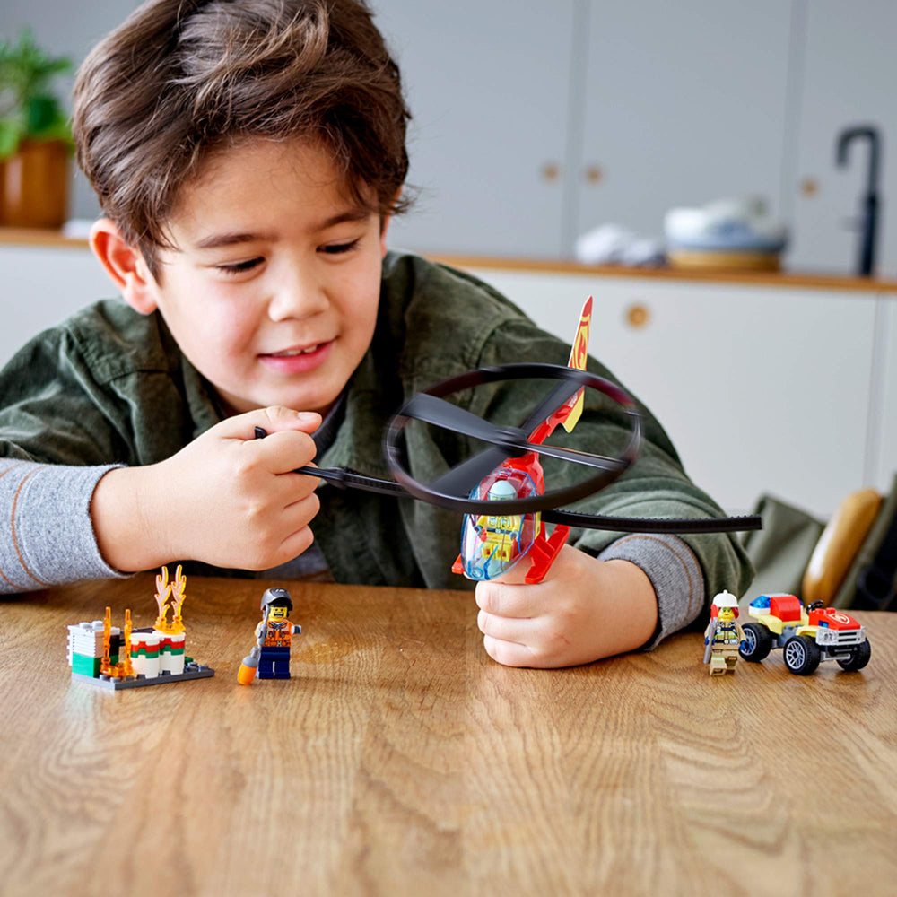 LEGO City Fire Helicopter Response burning pipe scene boosts dramatic rescue storytelling.