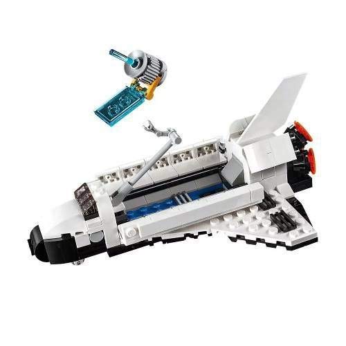 LEGO Creator 3in1 Shuttle Transporter crane in action during loading scenes.