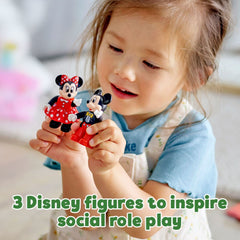 Minnie wears a fabric dress for imaginative dress-up moments.