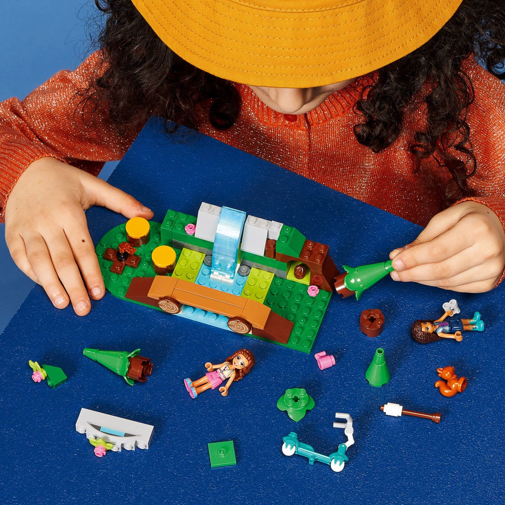 LEGO Friends forest waterfall bridge; supports collaborative play and river-crossing adventures