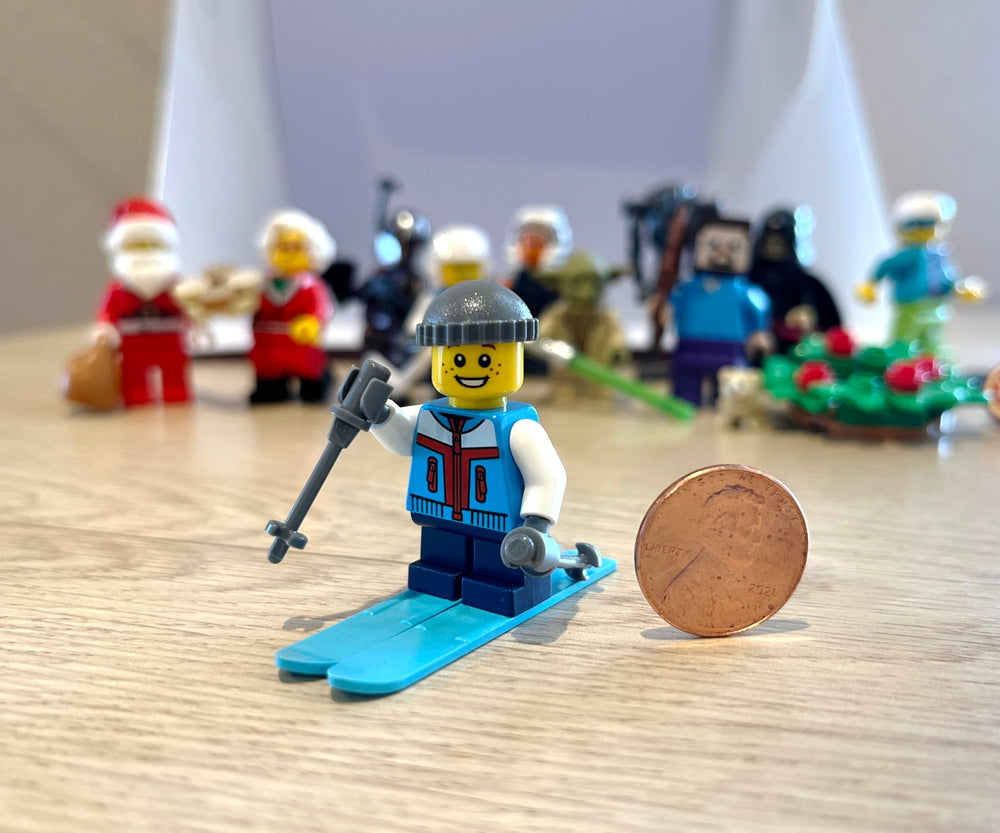 LEGO Holiday minifigure Skier Boy skies and poles in action pose for storytelling.