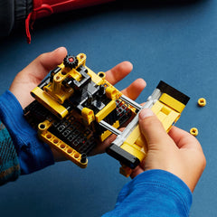 LEGO Technic bulldozer blade moves up and down for interactive play.