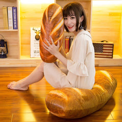 Levenkeness 100 cm bread cushion displayed on sofa as a playful lounge companion.
