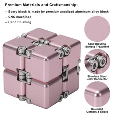 Lifidea Infinity Cube Pink held in hand during focused desk use.