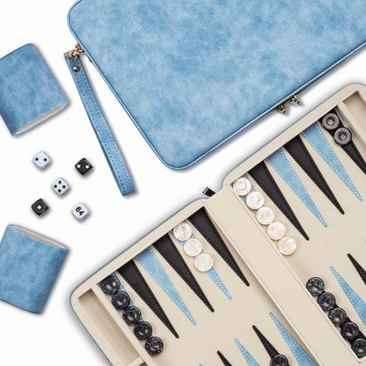 Lingle Backgammon folding faux leather case keeps pieces organized on the go.