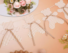 LINLULU bear banner doubles as nursery wall art between celebrations.