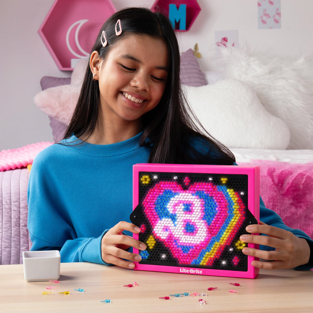Lite Brite Barbie Edition includes 1,000 mini pegs for colorful scenes.