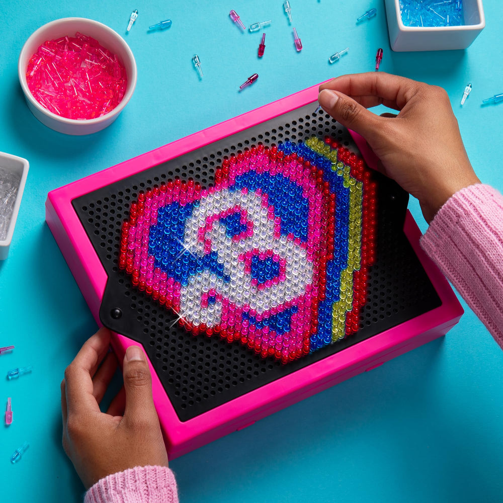 Lite Brite Barbie Edition's snap-on grid keeps designs centered and bright.
