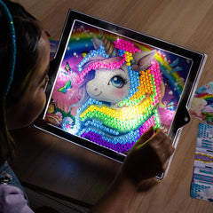 Lite-Brite ColorPOP pull-out easel displaying finished glow-in-the-dark artwork
