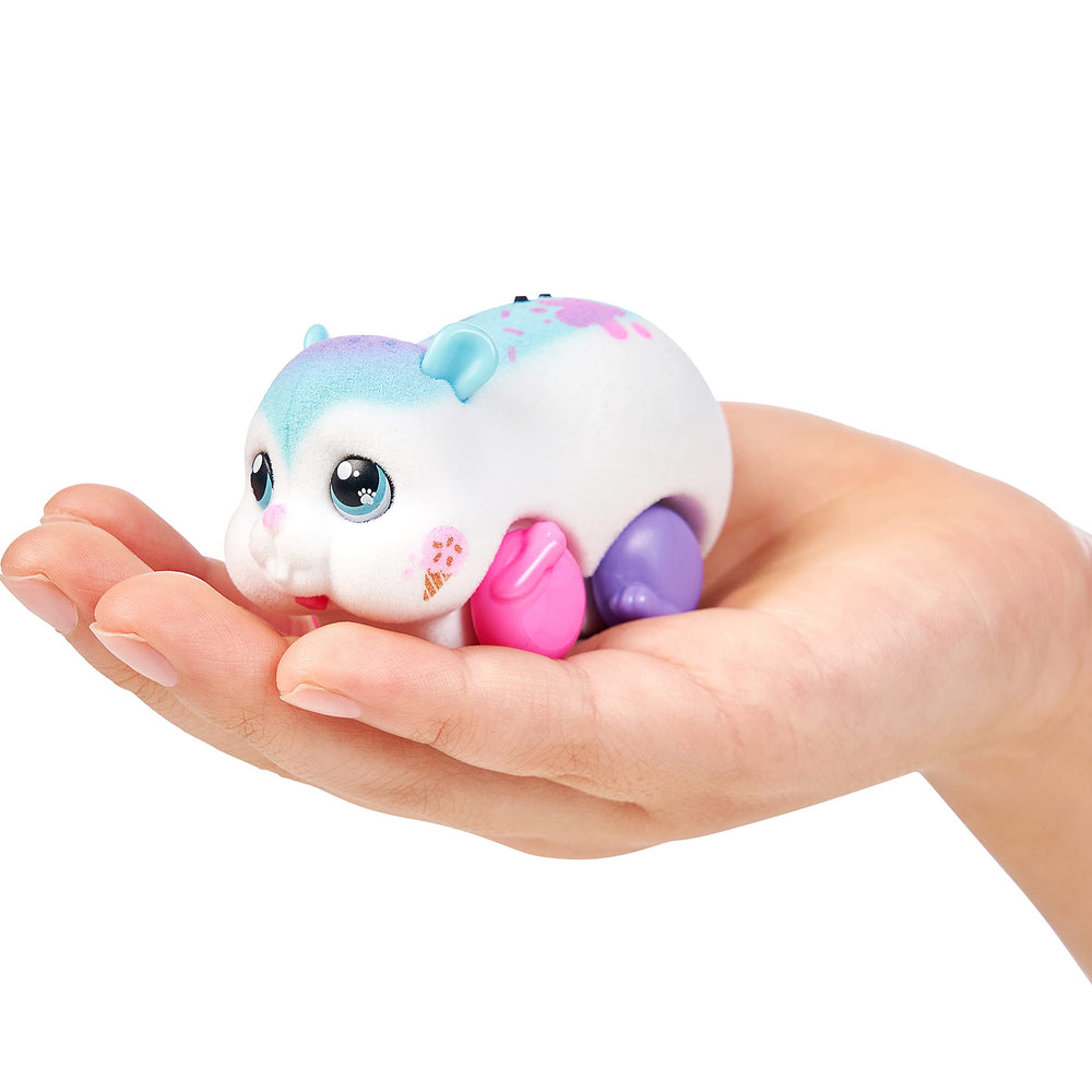 Little Live Pets Sprinkz scurries around, sparking playful adventures.