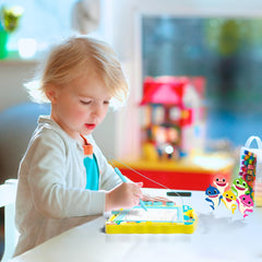 Child uses the Lollipop Baby Shark board for imaginative play