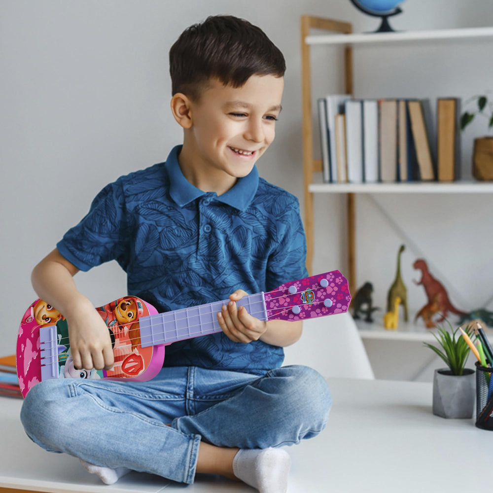 Lollipop Paw Patrol Party Ukulele held by small hands, perfect starter instrument