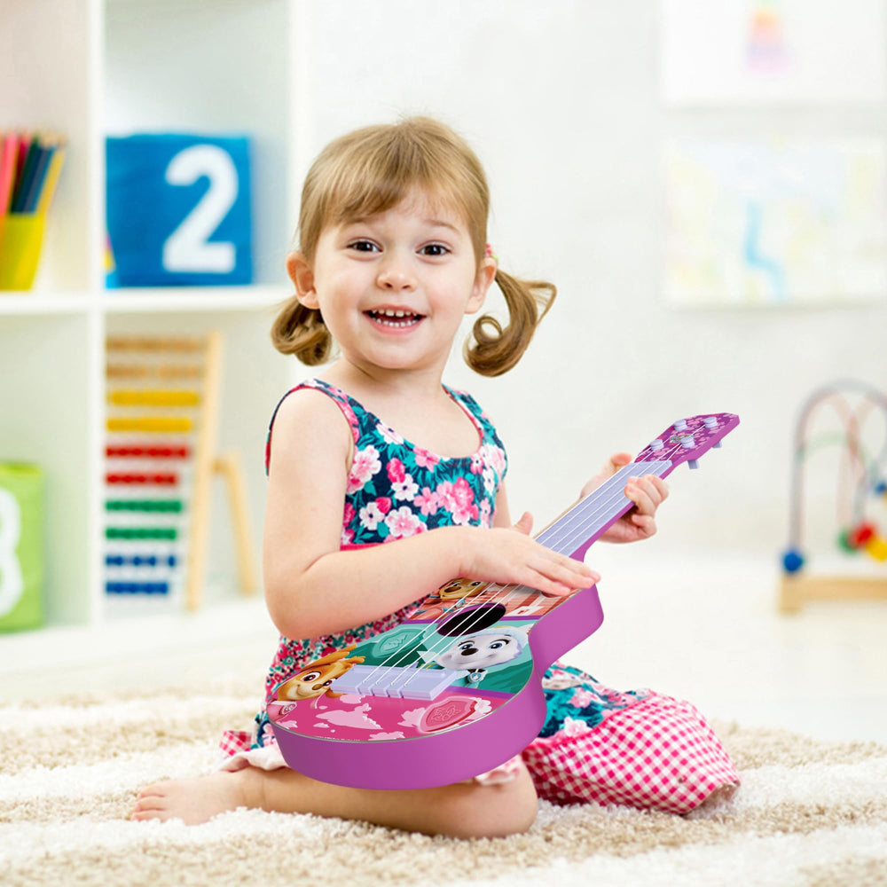 Lollipop Paw Patrol Party Ukulele with strap in use, portable musical playtime