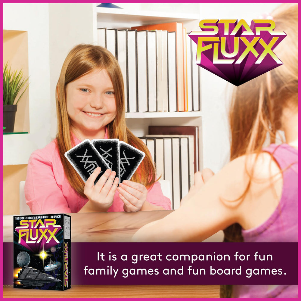 Looney Labs Star Fluxx illustrated playing cards on table