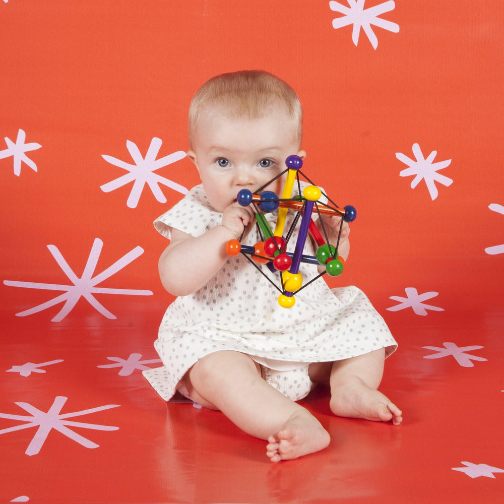 Manhattan Toy Skwish Classic 6 inch rattle and teether support soothing teething exploration.