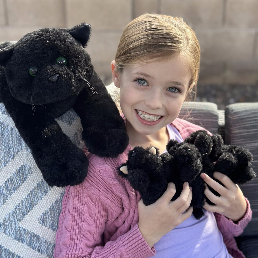 MaoGoLan black cat plush at bedtime, ideal for comforting kids at night.