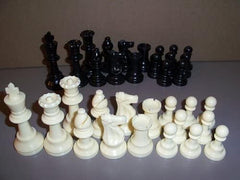 Marion chess pieces with felt bottoms protect boards during play.