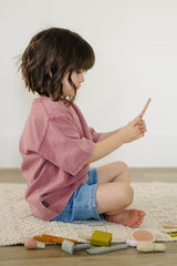 Marlowe & Co imaginative play scene with colorful silicone beauty tools.