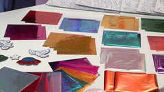 Marvin's Magic Rainbow Stickers holographic sheets sparkle for gift decorations and journaling.