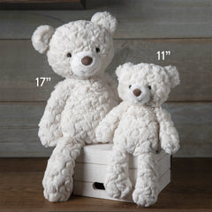 Putty Bear cream pose in crib demonstrating nursery-friendly display