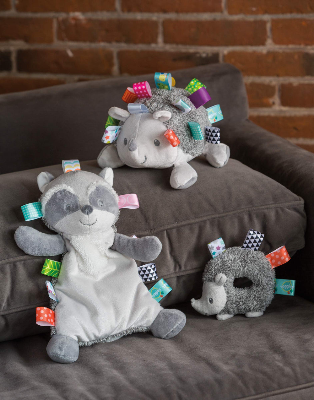 Mary Meyer Taggies Harley Raccoon Lovey with satin tags for tactile exploration.