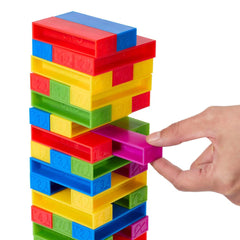 A player adds a block to the growing UNO Stacko tower