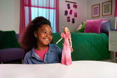 Mattel Glinda wearing removable pink ombre dress for styling.