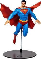 McFarlane Toys DC Multiverse Superman 12in statue on display shelf, ideal for collection.