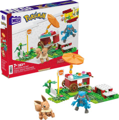 Mega Pokémon picnic set featuring Eevee and Riolu figures for imaginative play.