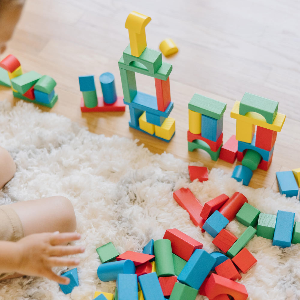 Melissa & Doug child building a tower demonstrating fine motor skill development