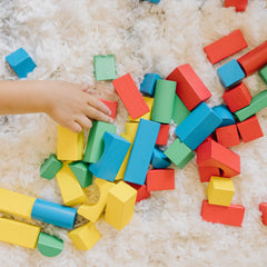 Melissa & Doug blocks spread on floor illustrating colorful open-ended play possibilities