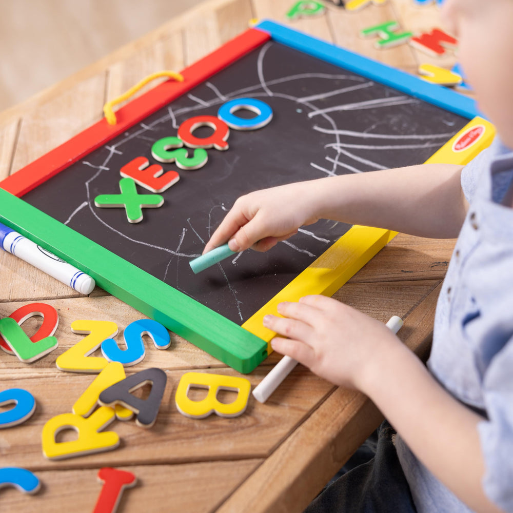 Double-sided activity board ideal for drawing, spelling, and counting.