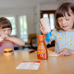 Melissa & Doug durable plastic condiment containers endure active playtime.
