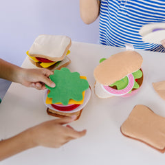 Melissa and Doug felt sandwich condiments emphasize finishing touches for creative orders.