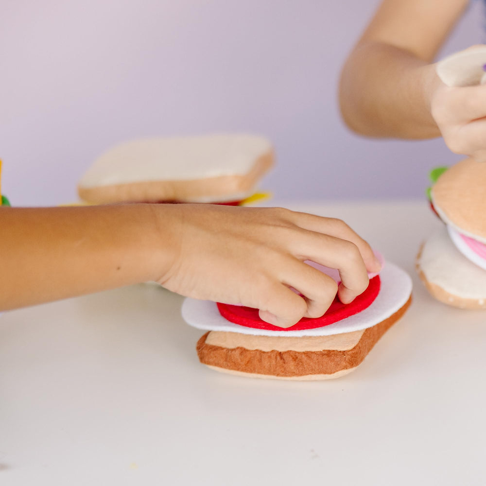 Melissa and Doug felt sandwich grinder hoagie section demonstrates layering and imagination.