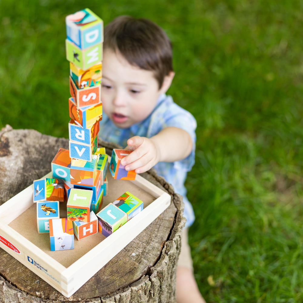 Melissa & Doug Identification guides in English and Spanish support bilingual learning.
