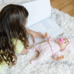 Jenna 12-inch doll with eyes that open and close for nap-time moments.