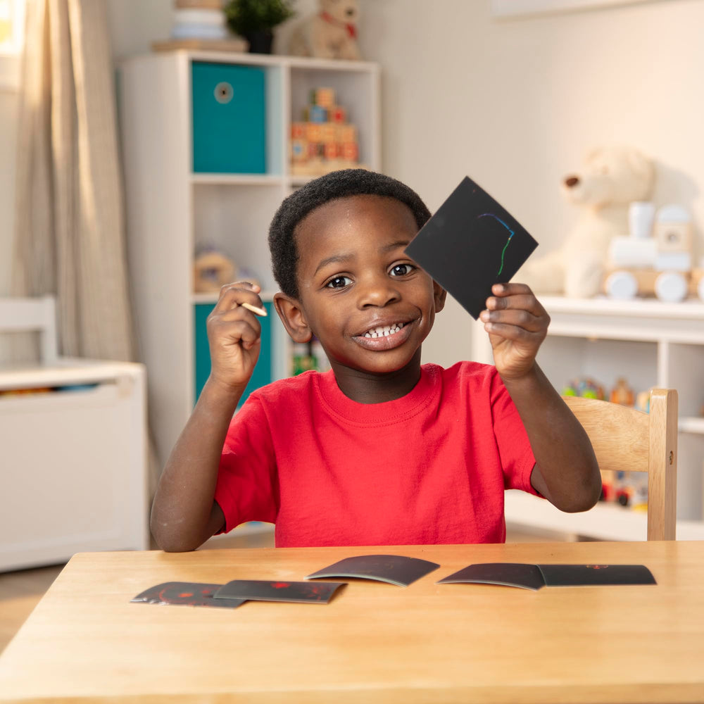 Melissa & Doug Scratch Art notes encourage hands-on creativity and fine motor exploration.