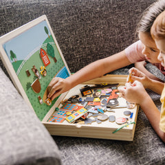 Children playing Melissa & Doug magnets to match pictures