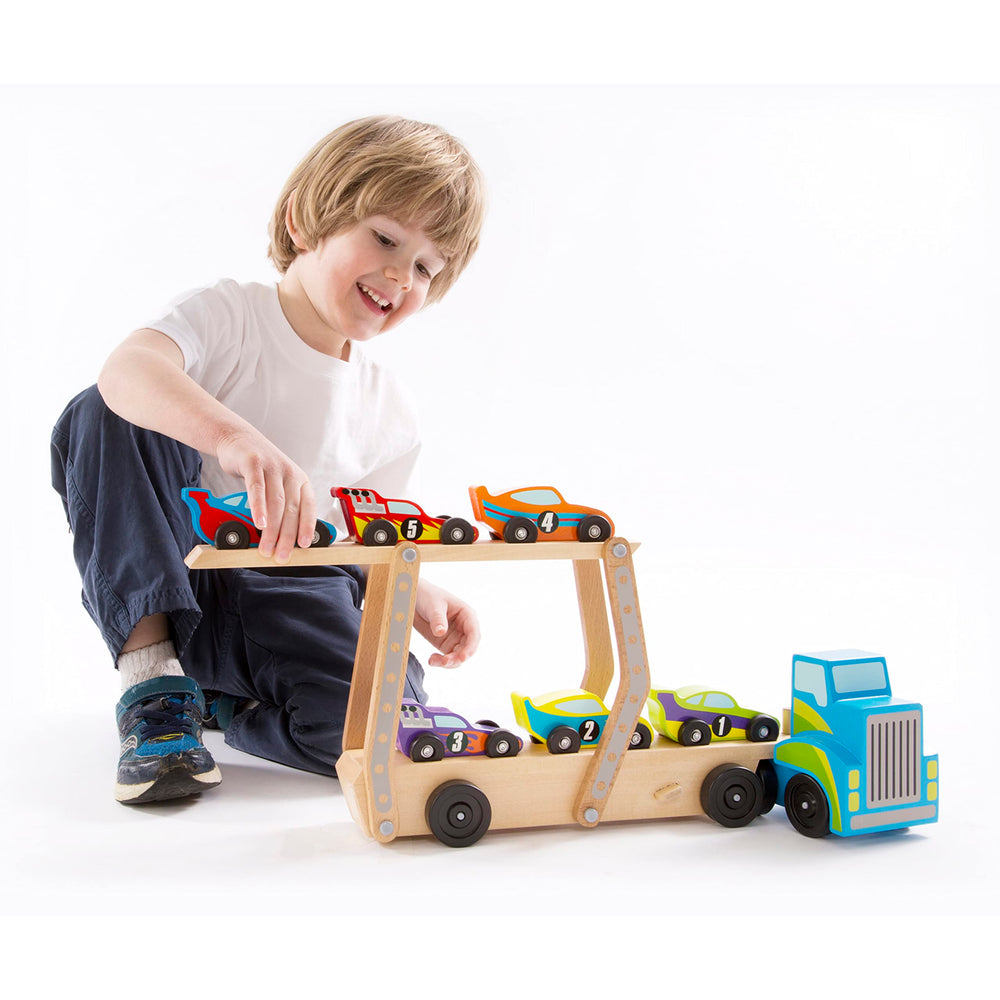Melissa & Doug Mega Race-Car Carrier includes six numbered cars for counting and color recognition.