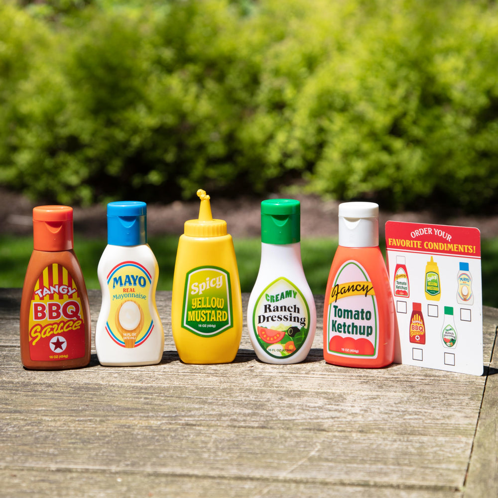 Melissa & Doug pretend picnic scene with easy-to-grip condiment bottles.