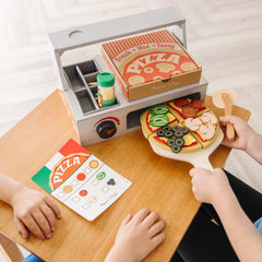 Wooden paddle and rolling cutter add authentic pizza prep play with Melissa & Doug