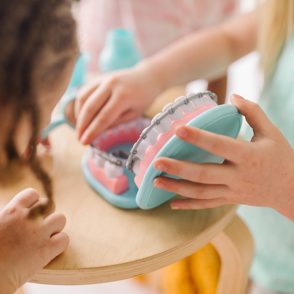 Melissa and Doug toothbrush and toothpaste set encourages brushing practice during playtime
